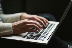 An illustrative photo of a person using a laptop