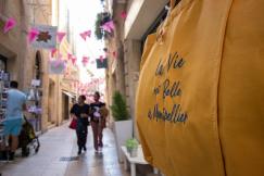 An illustrative photo of a couple of people are walking down a street