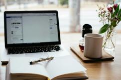 An illustrative photo of a laptop near the window