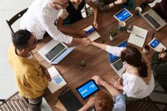 An illustrative photo of a group of professionals engaged in a collaborative discussion
