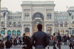 An illustrative photo of a man standing in downtown.