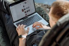 An illustrative photo of an individual using a laptop