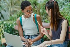 An illustrative photo of female students working on assignment