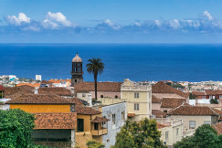An illustrative photo of buildings on the coast of body of water