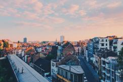 An illustrative photo of a city with high rise buildings.