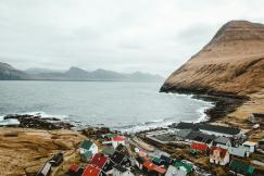 An illustrative photo of houses on seashore 