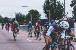An illustrative photo of group of men riding bicycles