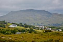 An illustrative photo of houses in the mountains