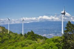 An illustrative photo of three wind energy generators on a hill