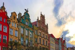 An illustrative photo of a row of buildings of different colours in Gdansk