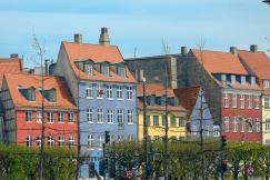 An illustrative photo of a row of colorful houses in Copenhagen