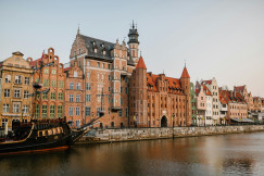 An illustrative photo of old European city district on river coast