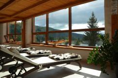 An illustrative photo of a spa room with a view of the mountains