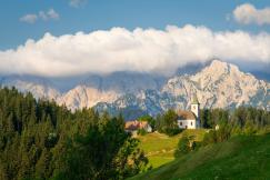 An illustrative photo of a church on a hill.