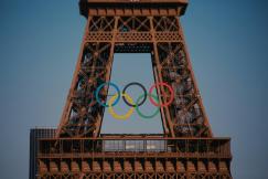 The eiffel tower with the olympic rings in front of it 