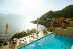 An illustrative photo of a large swimming pool next to the ocean