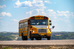 An illustrative photo of a school bus on the pathway.