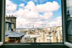 An illustrative photo of a view of Paris from a window