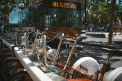 An illustrative photo of a bus near bikes.