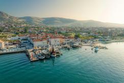 An illustrative photo of a harbor with boats in the water.