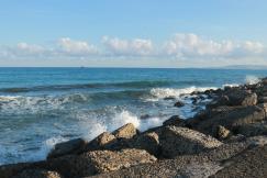 An illustrative photo of a view of the sea from a rocky shore.
