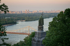 An illustrative photo of a brown suspension bridge.