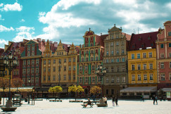 An illustrative photo of people walking on a square in Wrocław, Poland