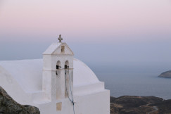 An illustrative photo of a white concrete building.