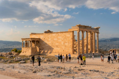 An illustrative photo of a group of people standing in front of a building.