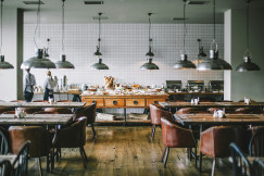 An illustrative photo of tables inside of the restaurant
