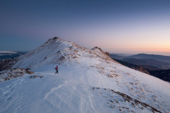 An illustrative photo of snow covered mountains.