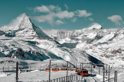 An illustrative photo of snow covered mountains.