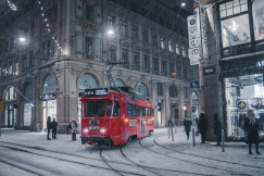An illustrative photo of a red city train on the tracks.