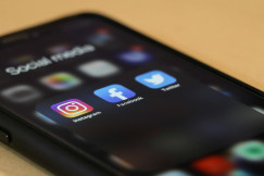 An illustrative photo of three social media on iPhone's screen