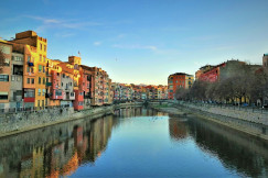 An illustrative photo of colorful buildings near a body of water
