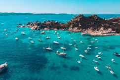 Photo by Unsplash An illustrative photo of a group of boats floating on top of a body of water