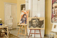 An illustrative photo of white wooden door near white wooden table