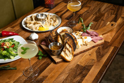 An illustrative photo of a table with food and drinks on it