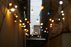 An illustrative photo of lights between two walls with a window in front