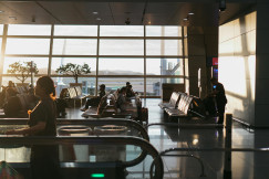 An illustrative photo of people sitting in the airport