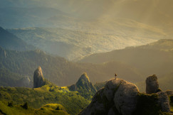 An illustrative photo of mountains hit by sun rays