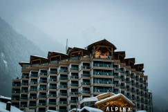 An illustrative photo of a modern hotel in the mountains
