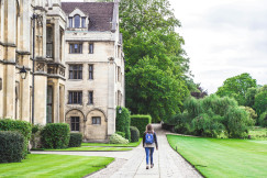 An illustrative photo of a student walking near university