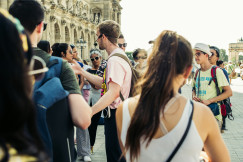 An illustrative photo of people with tour guide