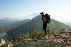 An illustrative photo of a woman hiking in the mountains