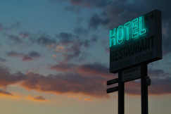 An illustrative photo of a green hotel led light signage.