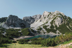 An illustrative photo of a lake between mountains