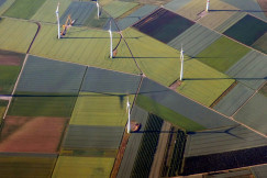 An illustrative photo of wind turbines on fields
