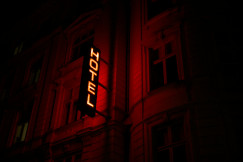 An illustrative photo of a building with a sign of it.