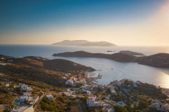 An illustrative photo of a city near body of water during daytime